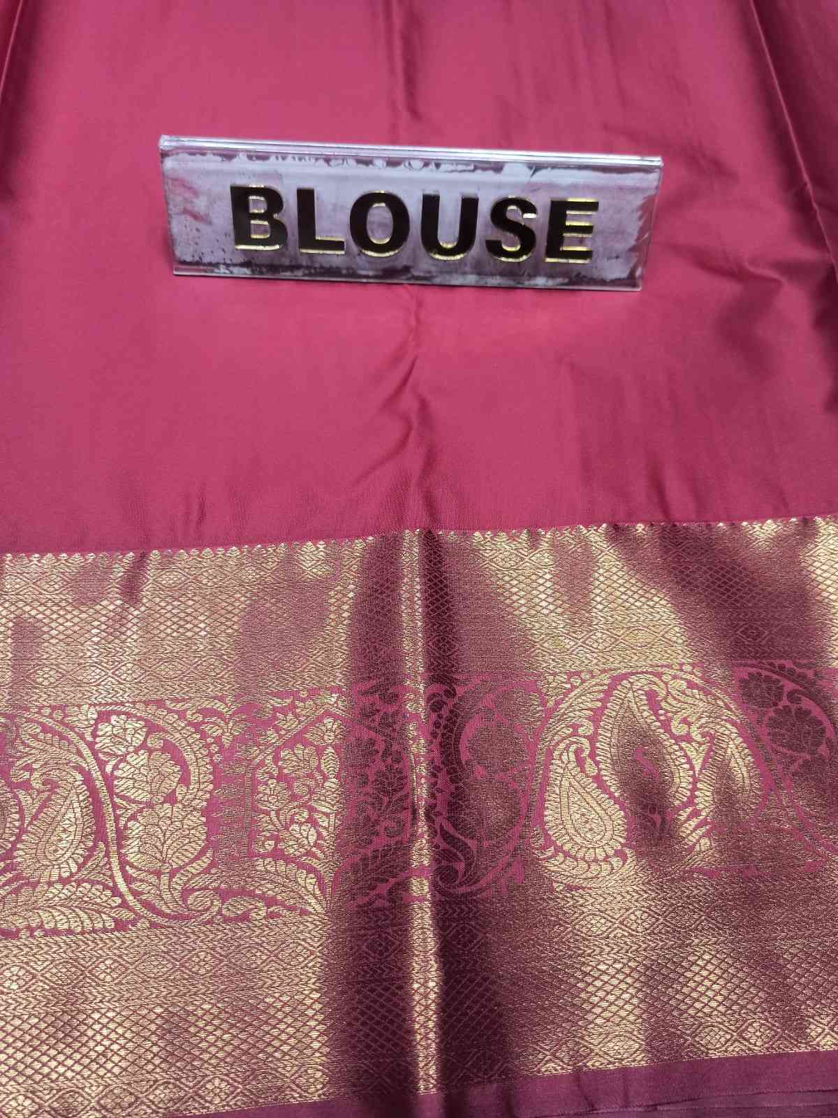 Maroon blouse with gold embroidery and a label reading 'BLouse'.