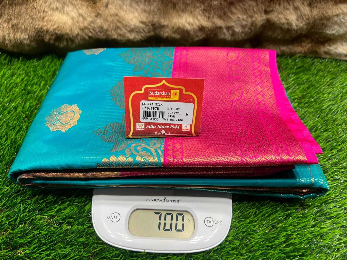 Colorful fabric with a brand label on a digital scale