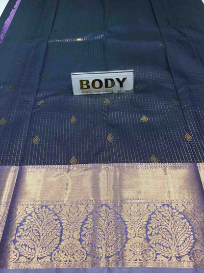 Navy blue saree with gold patterns and 'BODY' label.