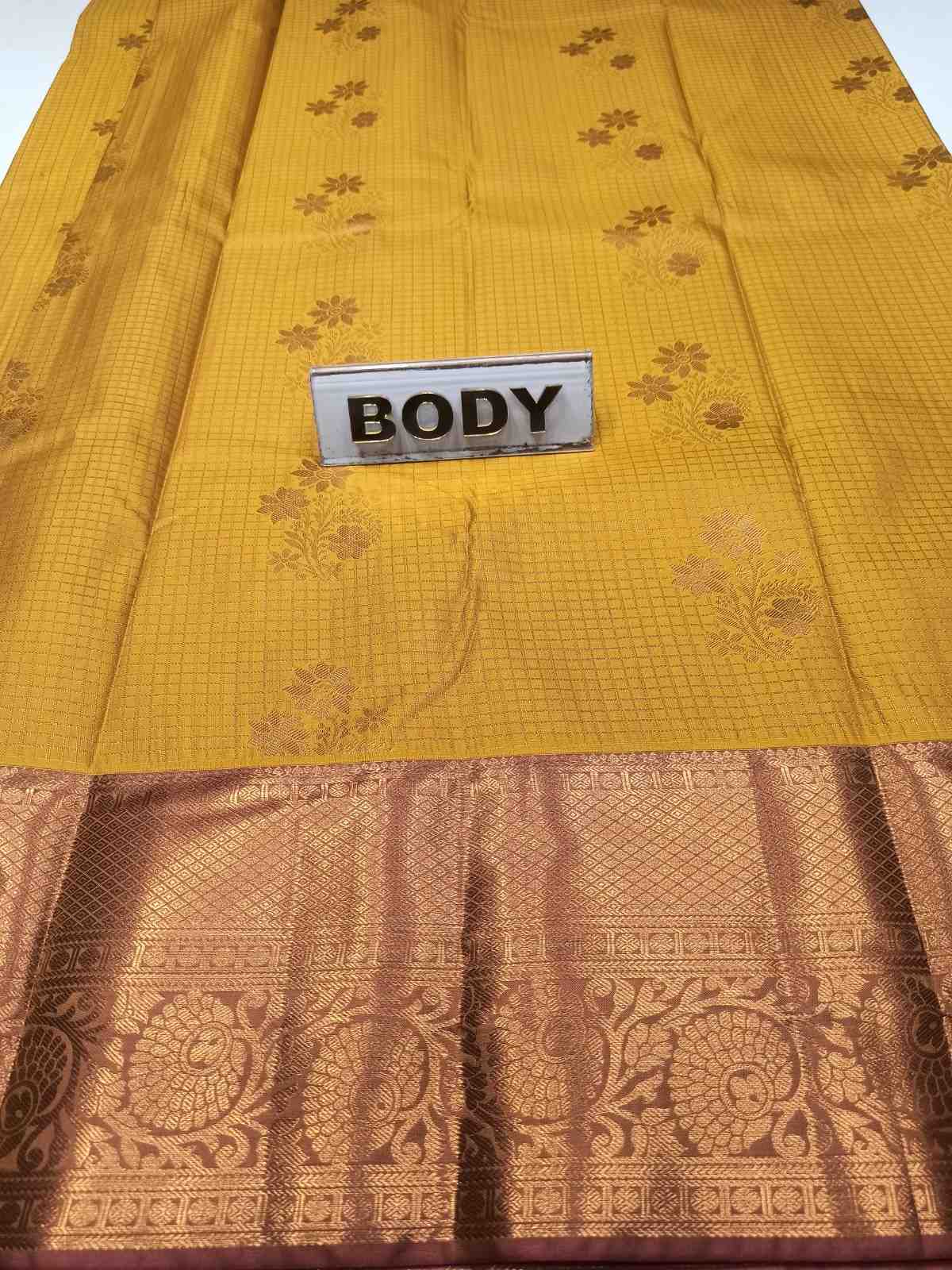 Yellow fabric with a brown pattern and a 'BODY' label.