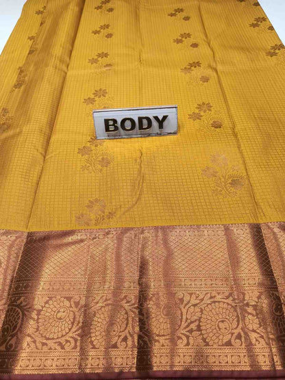 Yellow fabric with a brown pattern and a 'BODY' label.
