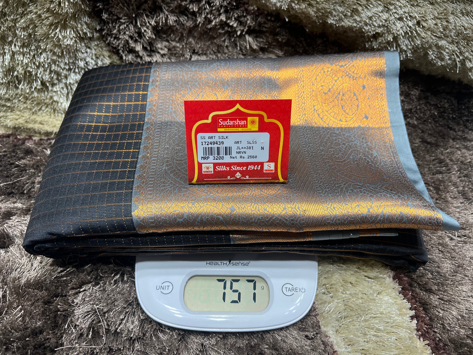 Folded fabric with a label on top of a digital scale
