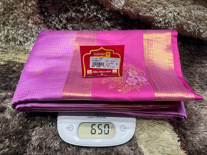 Purple saree with a brand label on a digital scale