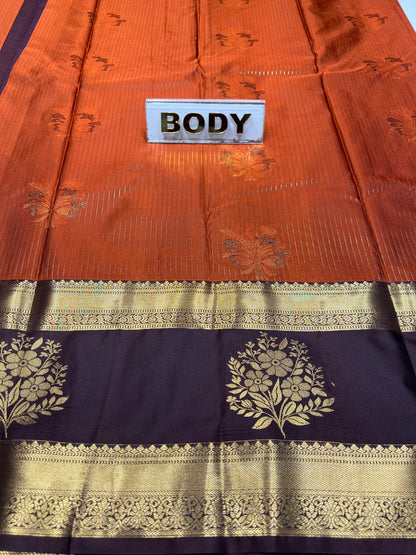 Saree with floral patterns and a label indicating 'BODY' on an orange and black background.