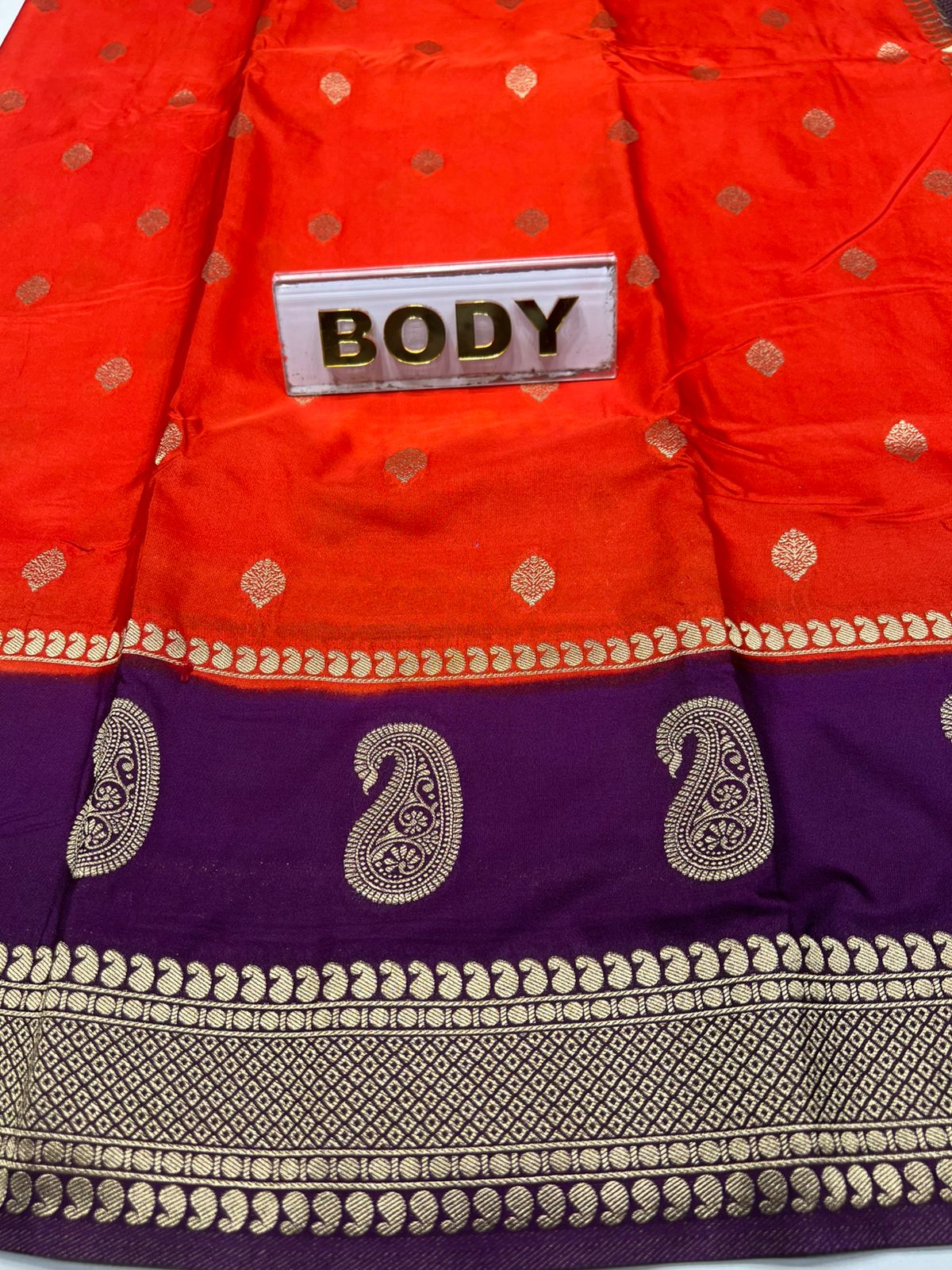 Red and purple saree with gold patterns and a label on a white background