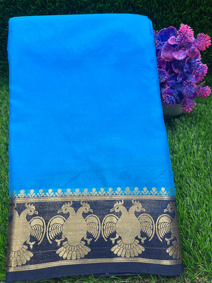 Blue saree with gold border on grass