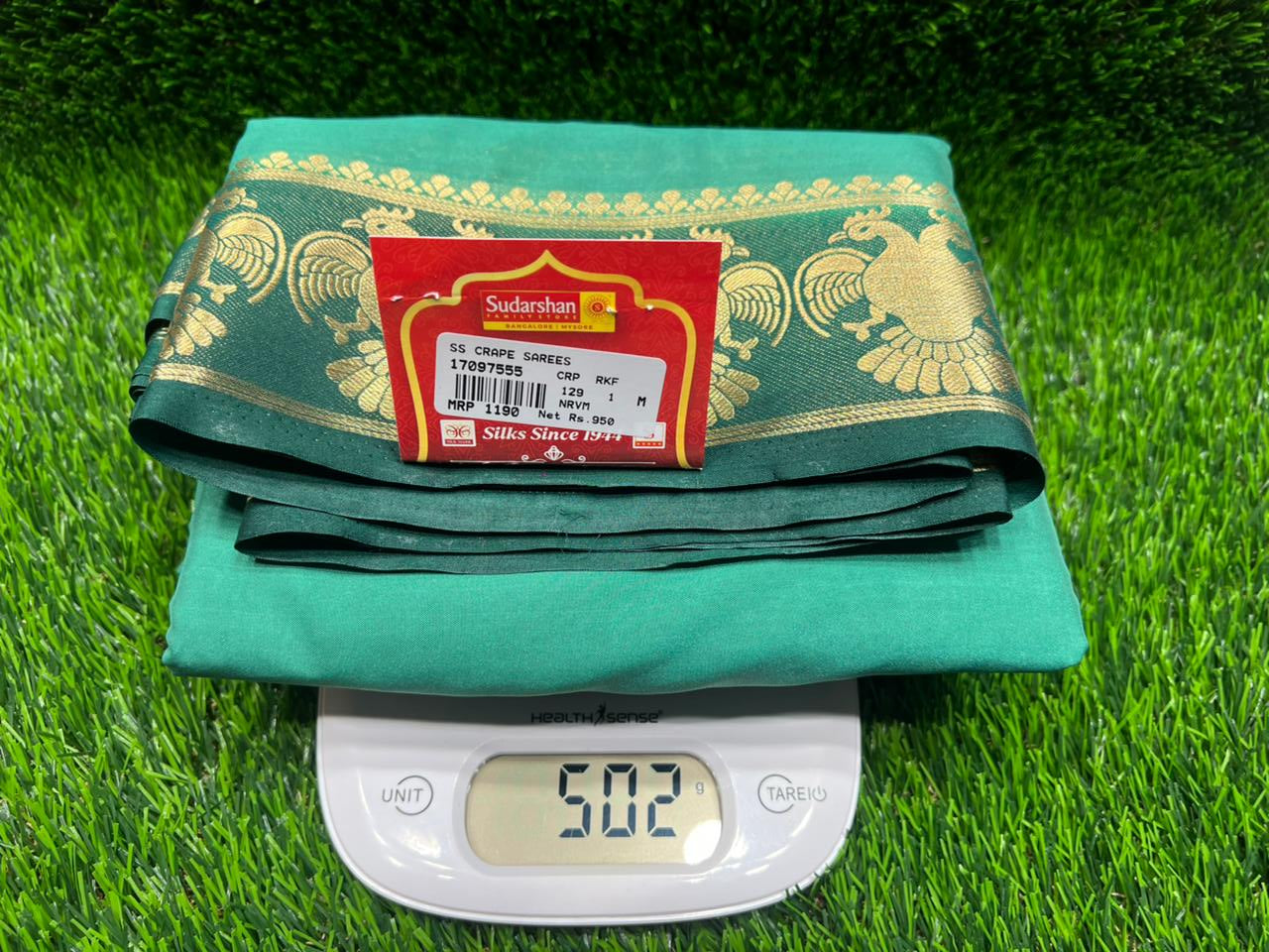 Green fabric with a red label on a grassy background