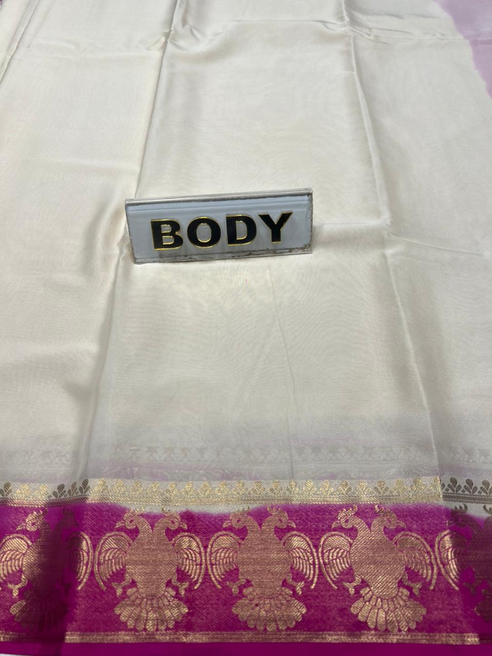 White fabric with a purple border and gold patterns, labeled 'BODY'.