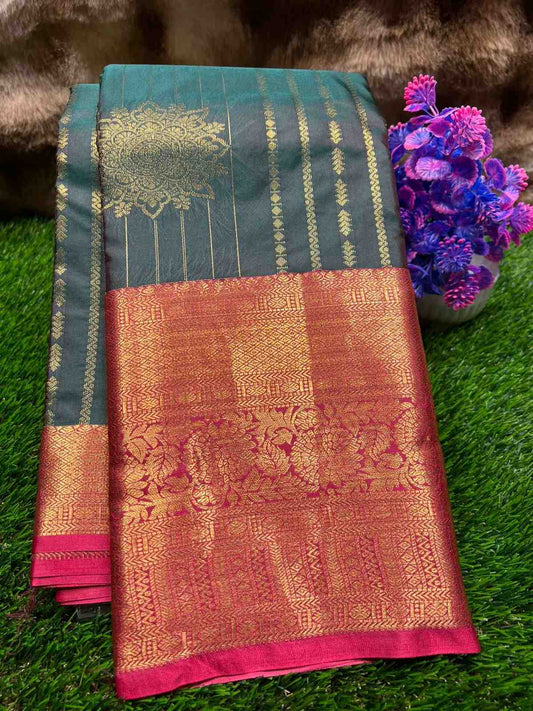 Traditional saree with intricate patterns on a green grass background