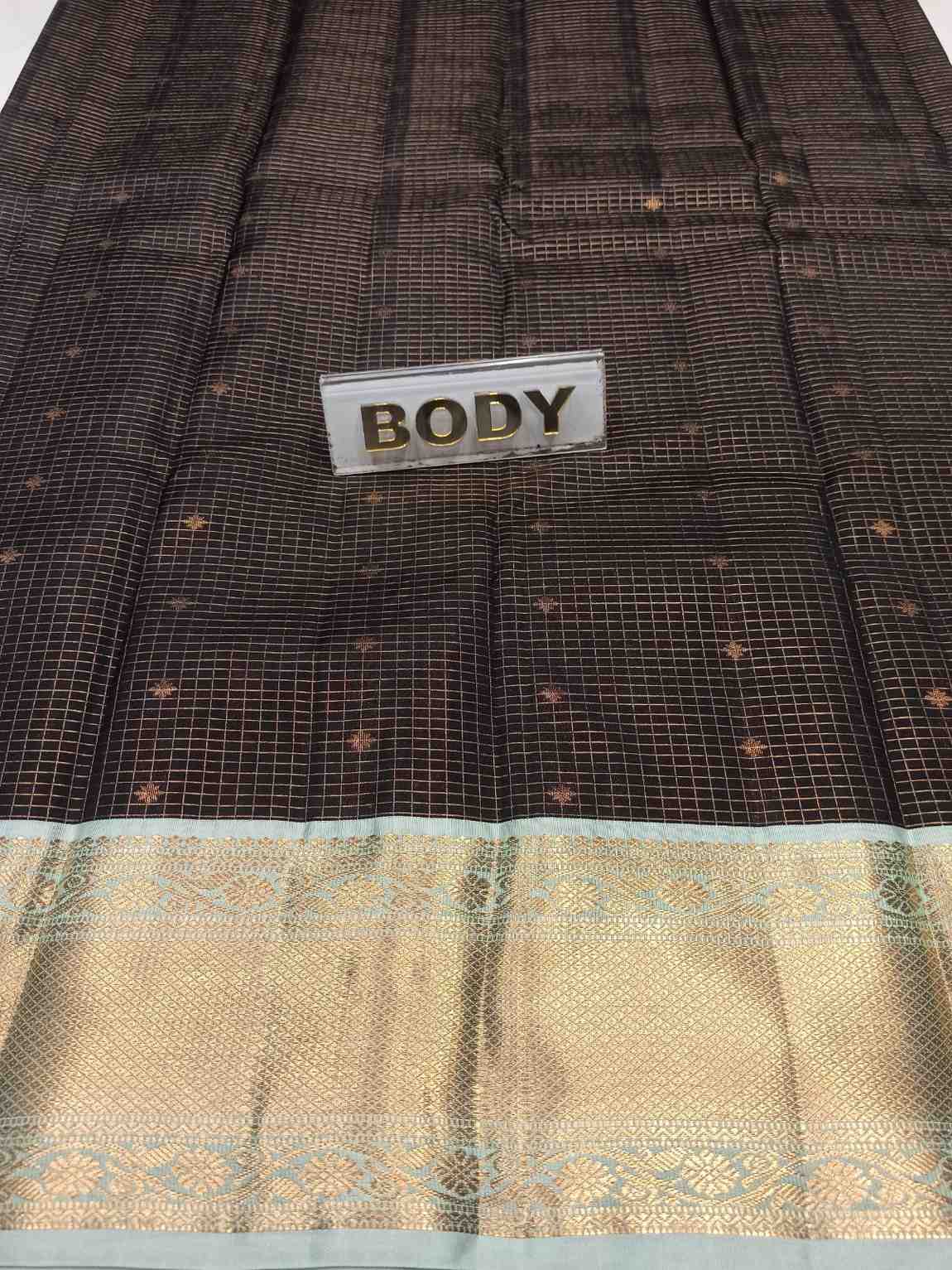 Textile with a label labeled 'BODY' on a patterned fabric background