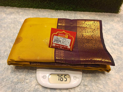 Yellow and purple fabric with a brand label on a digital scale
