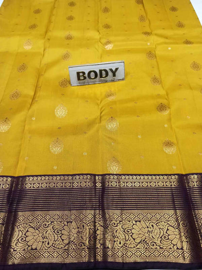 Yellow fabric with black and gold patterns and a 'BODY' label.