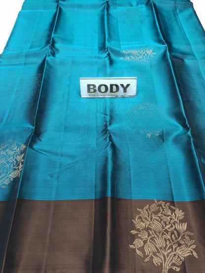 Teal fabric with floral patterns and a label labeled 'BODY' on a white background