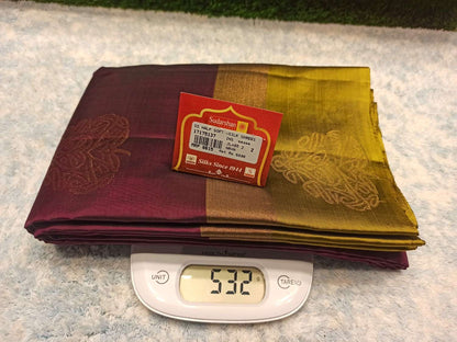 Two folded sarees on a digital scale with a brand label visible.