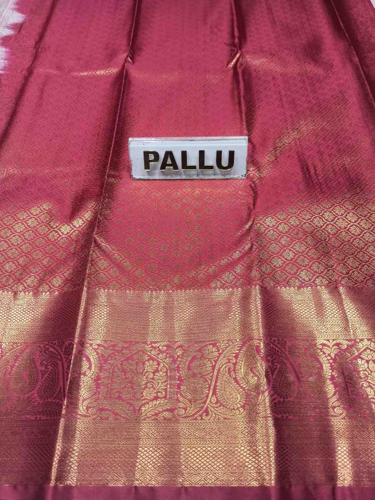 Maroon saree with gold patterns and a label indicating 'Pallu' on a white background