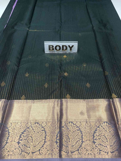 Dark green saree with gold border and 'BODY' label on a white background