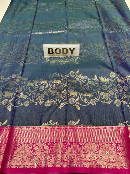 Teal and pink saree with intricate patterns and a label reading 'BODY'.