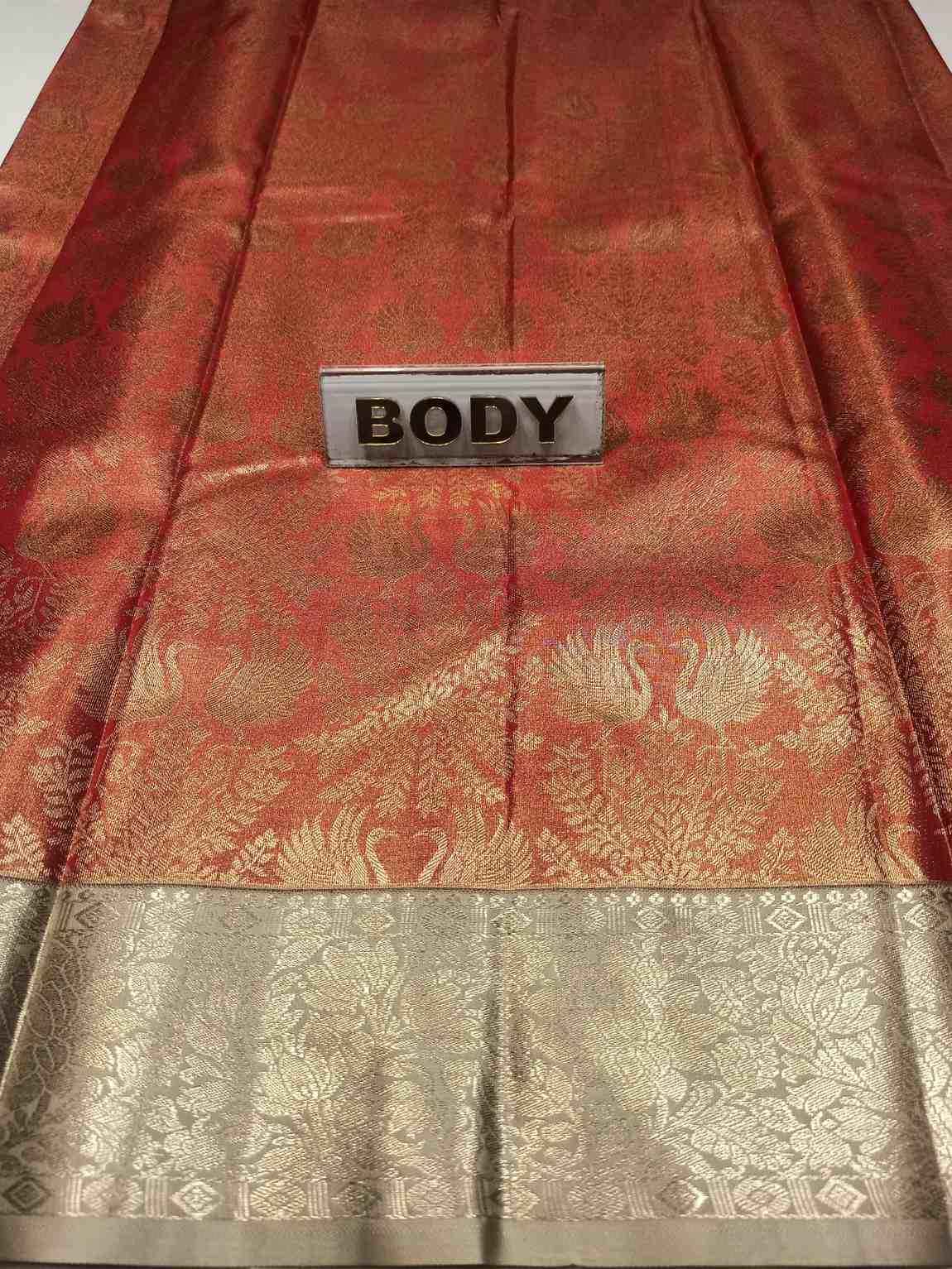 Red and gold saree with a 'BODY' label on a white background