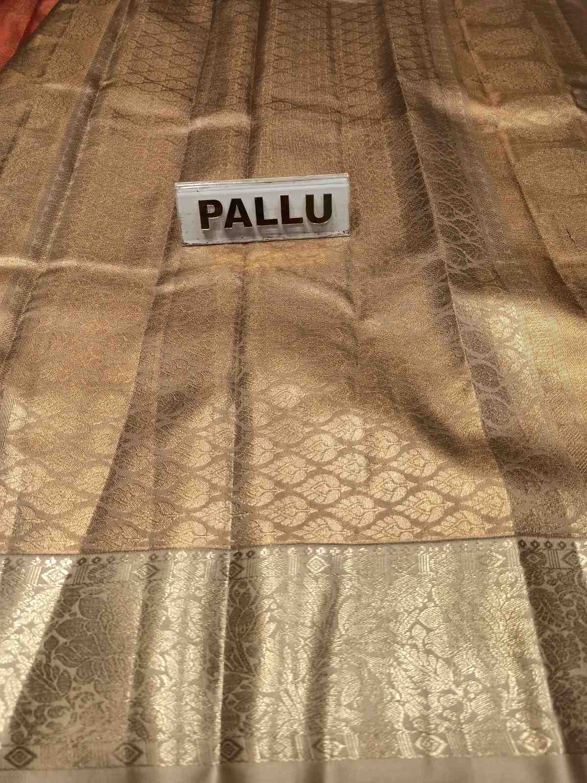 Brown fabric with a label labeled 'PALLU' on a checkered background
