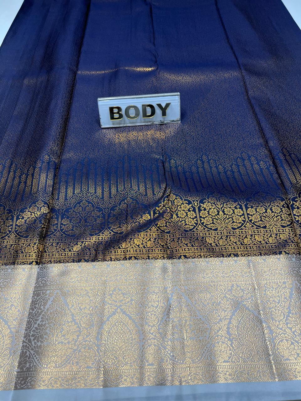 Blue fabric with gold patterns and a 'BODY' label.