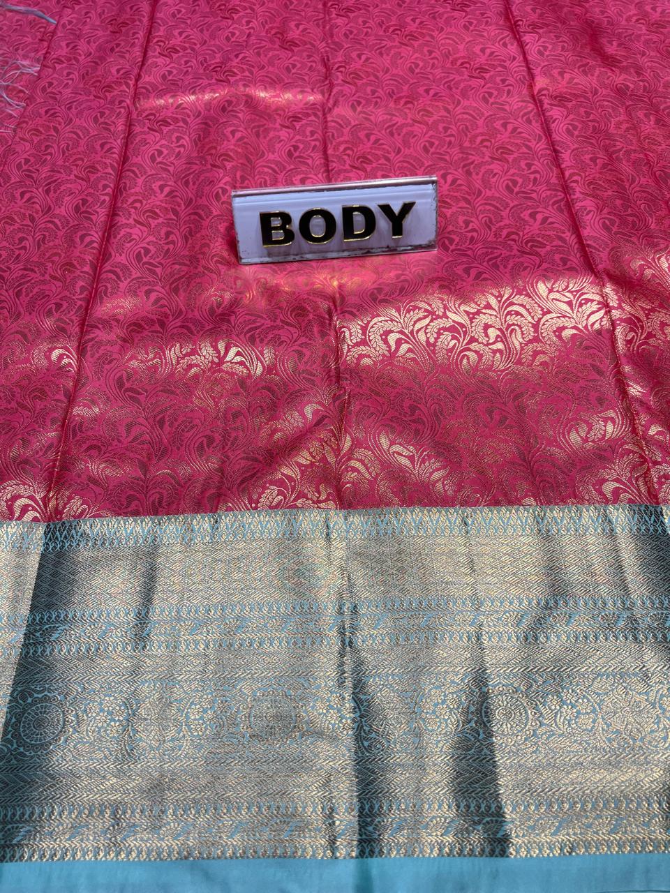 Saree with pink and blue patterned fabric and a label labeled 'BODY'.