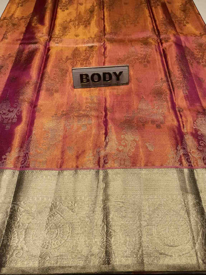 Decorative fabric with a 'BODY' label on an orange and gold patterned background