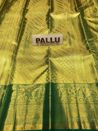 Green saree with a label indicating 'Pallu' on a textured fabric background