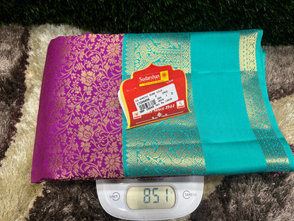 Teal and purple fabric with a label on a digital scale