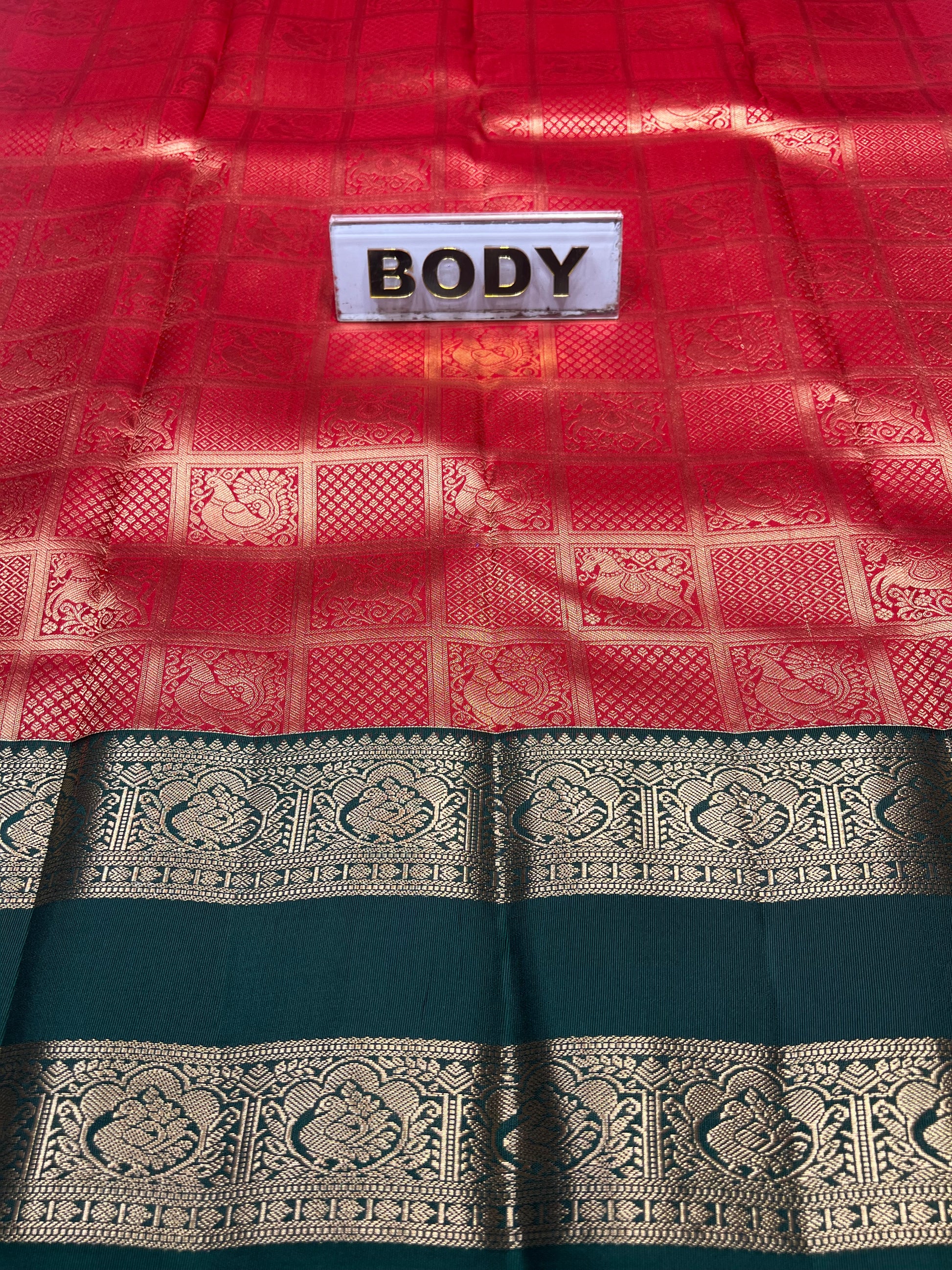 Red and black patterned fabric with a label labeled 'BODY'.
