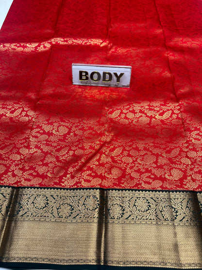 Red fabric with gold patterns and a 'BODY' label, next to black and gold patterned fabric.