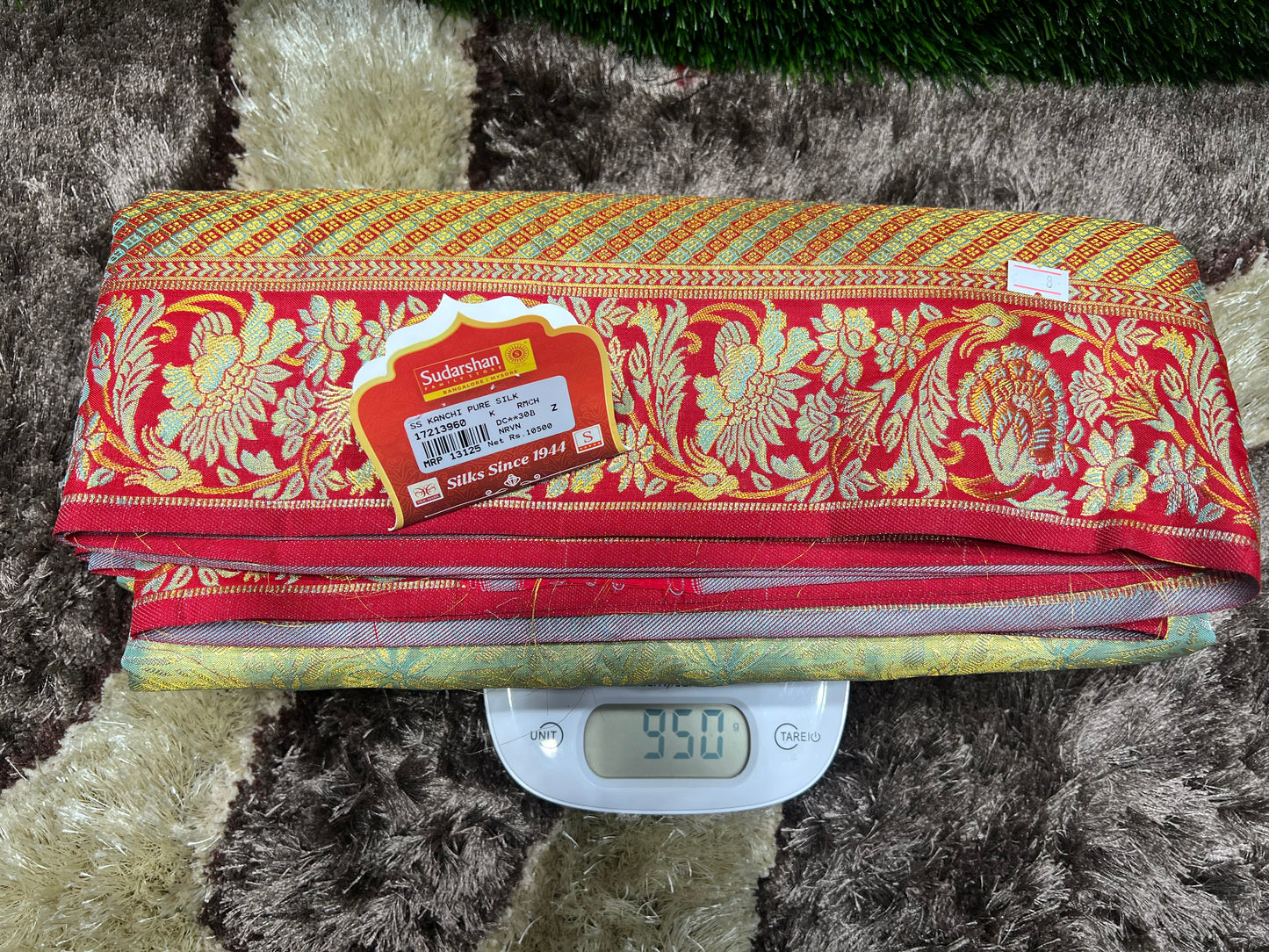 Fabric with a decorative pattern on a digital scale against a textured background