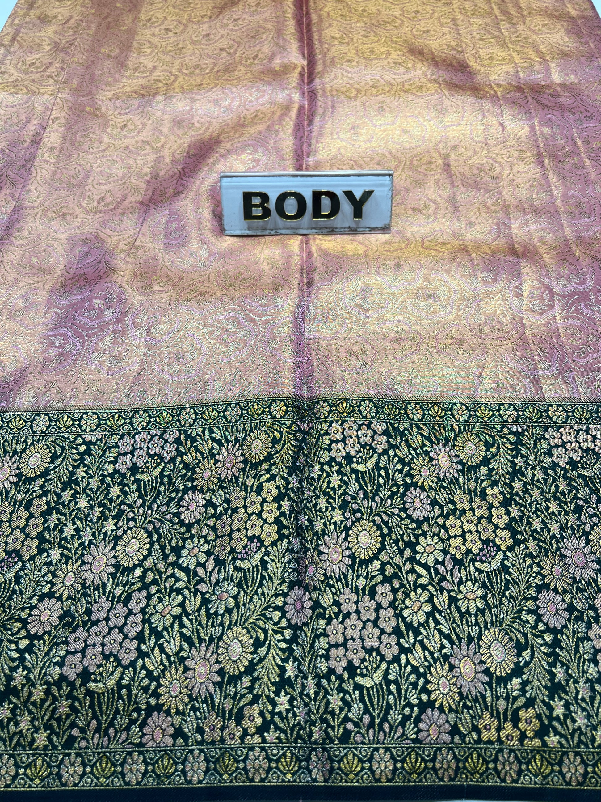 Two fabric samples with different patterns and a label labeled 'BODY'.