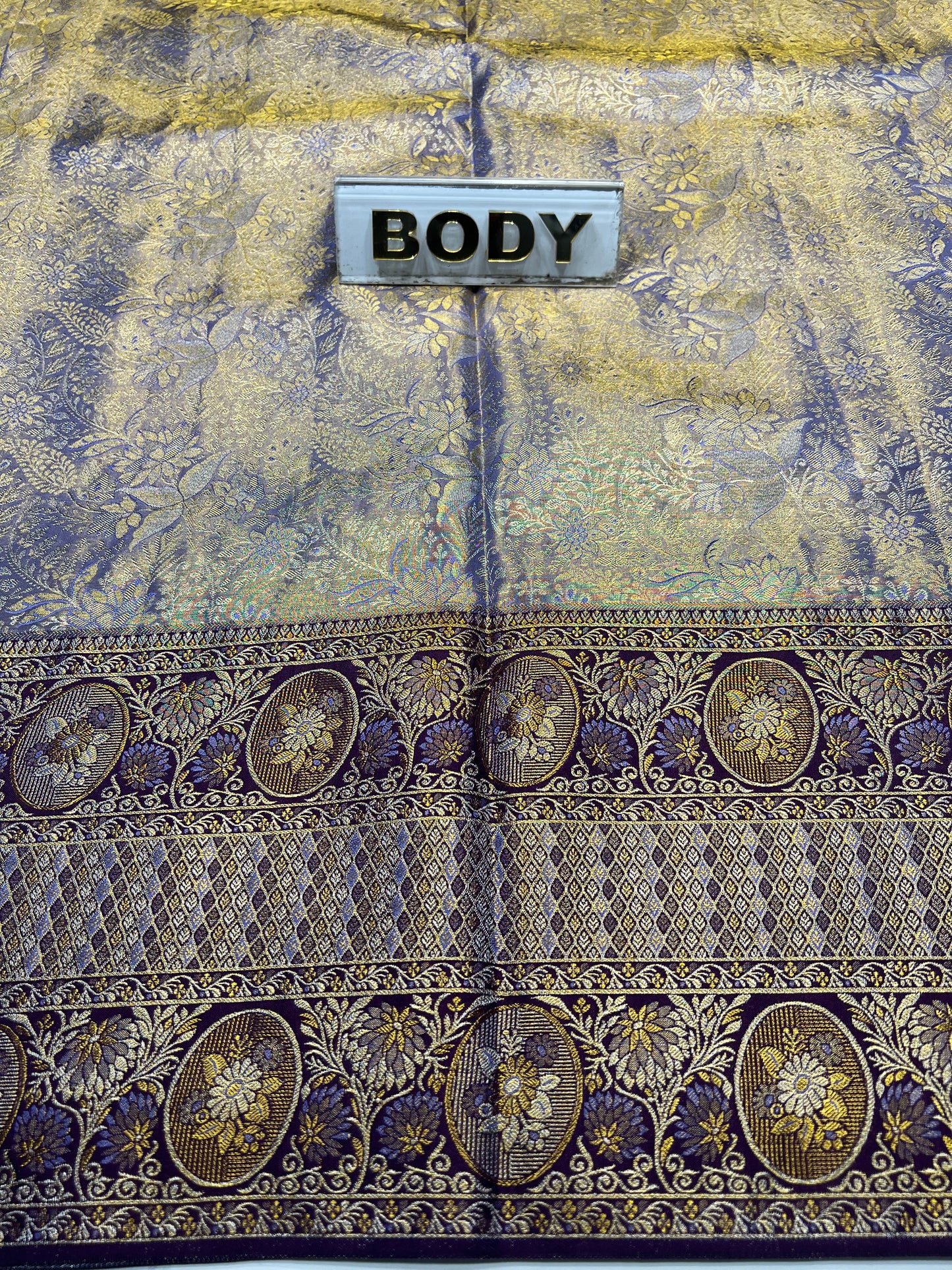 Decorative fabric with intricate patterns and a label labeled 'BODY'.