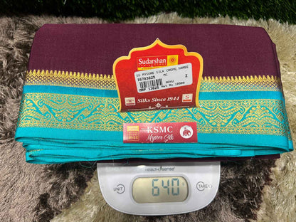 Saree with a brand label on a digital scale