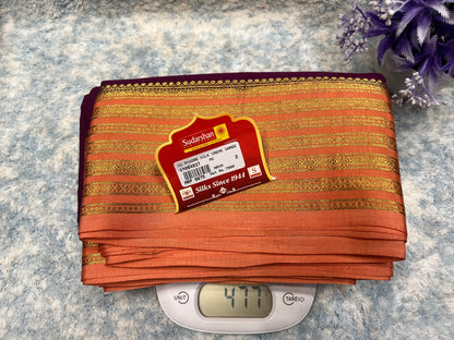 Packaged saree with a label on a digital scale