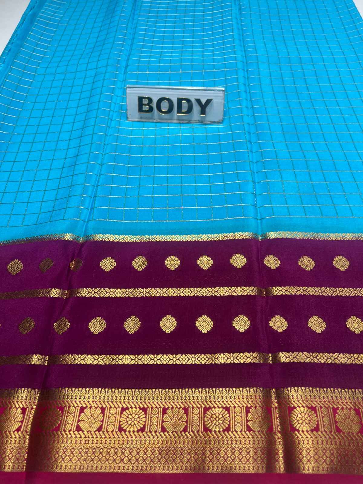 Blue and purple saree with gold patterns and a 'BODY' label.