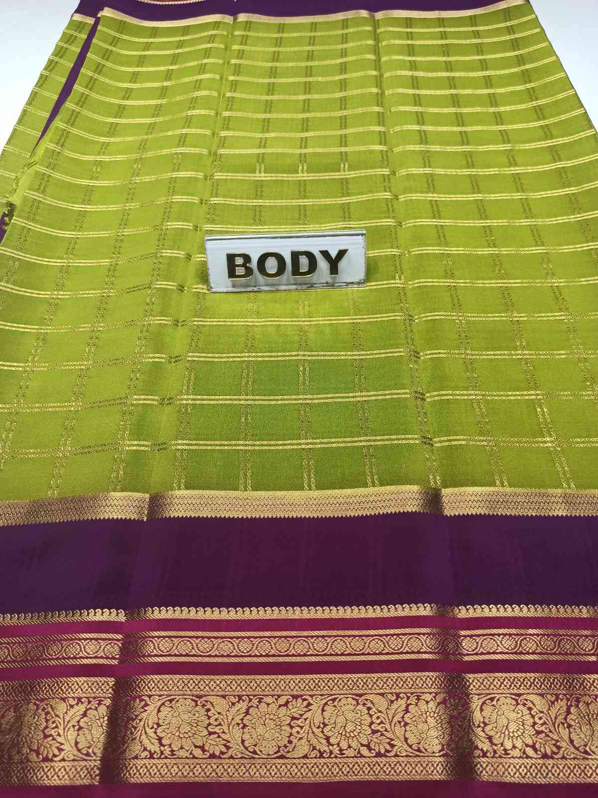 Green and purple saree with 'BODY' label