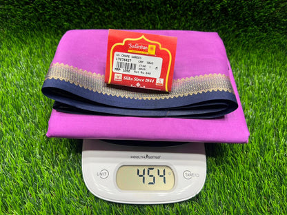 Digital pedometer on a pink mat with a red label on a green grass background