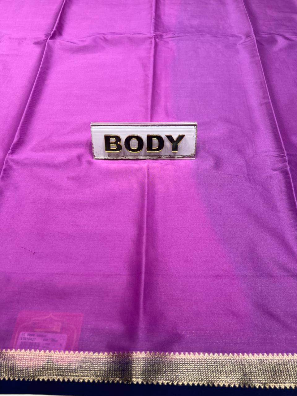 Purple fabric with a label that reads 'BODY' on a purple background