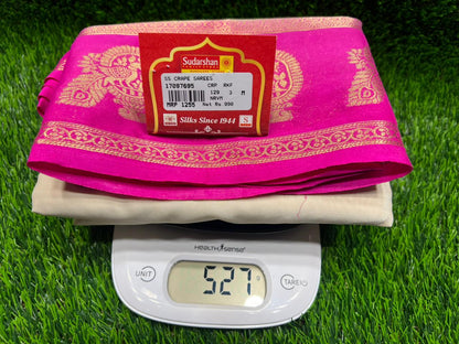Digital weight scale showing 2.75 kg on a pink and gold package with a red label on a green grass background.
