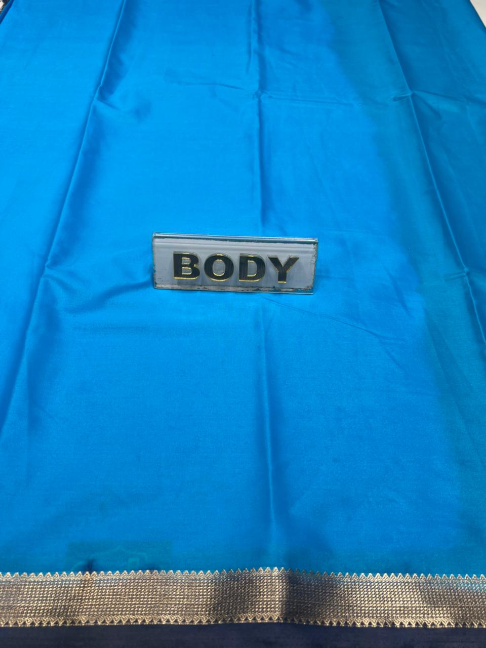 Blue fabric with a 'BODY' label on a blue background