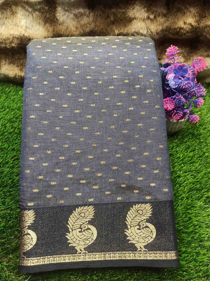 Dark blue fabric with gold patterns on a grassy background