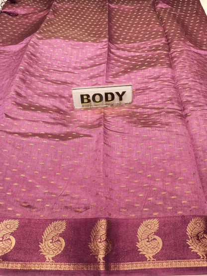 Close-up of a purple fabric with gold patterns and a label labeled 'BODY'.