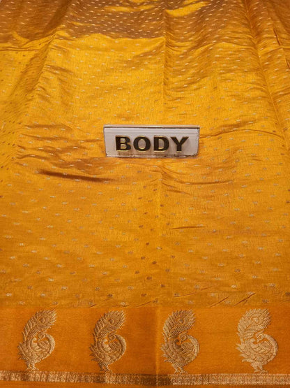 Yellow fabric with gold embroidery and a 'BODY' label.