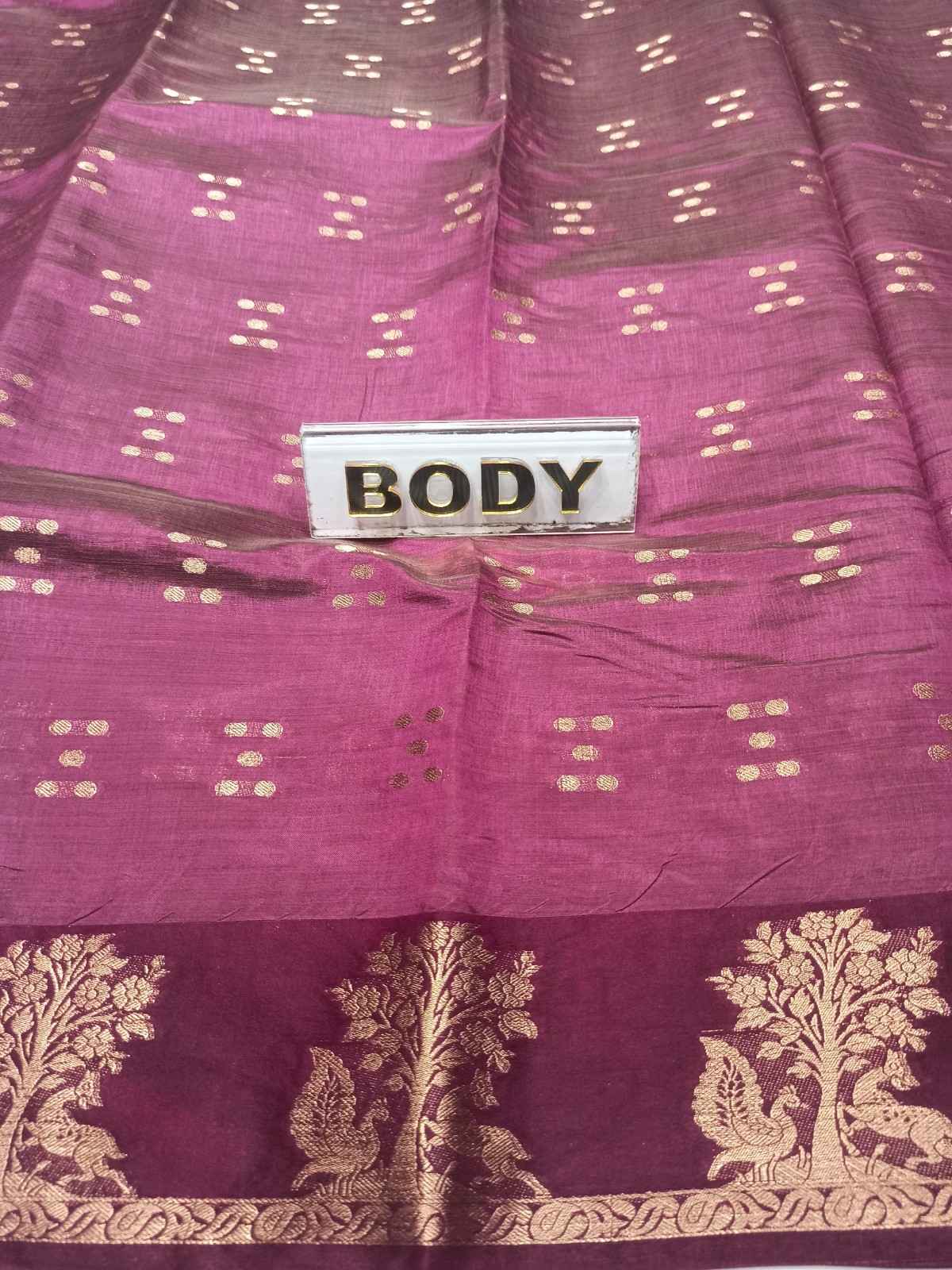 Purple fabric with gold patterns and a 'BODY' label.
