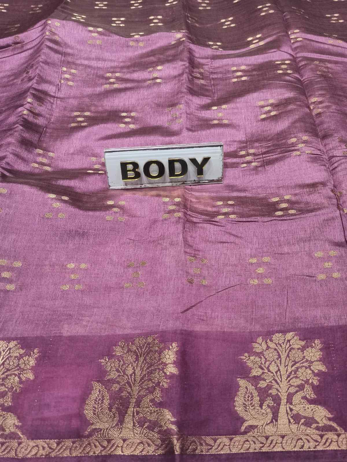 Purple fabric with gold patterns and a label labeled 'BODY'.