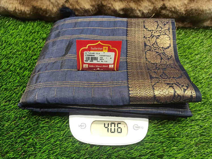 Folded fabric with a label on a digital scale against a grassy background