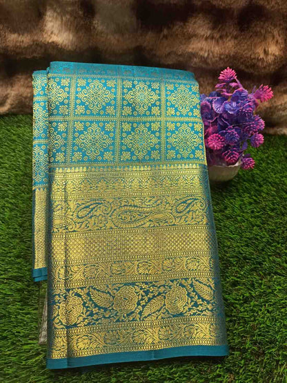 Decorative fabric with intricate patterns on a green surface
